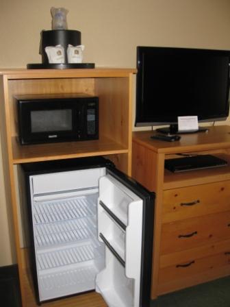 a small refrigerator and a tv
