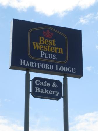 a sign board with a bakery and a sign