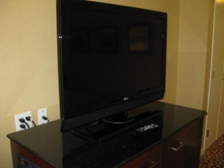 a flat screen television on a black counter