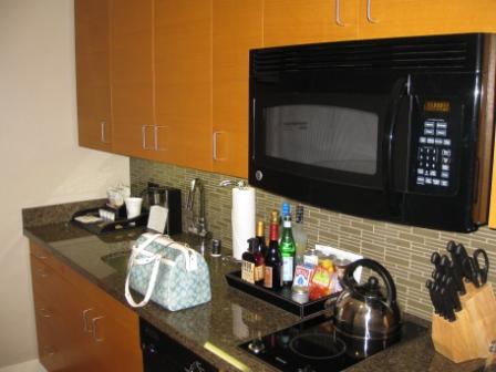 a kitchen with a microwave and coffee