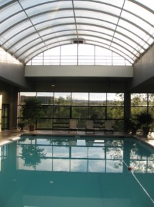 a swimming pool with a glass roof