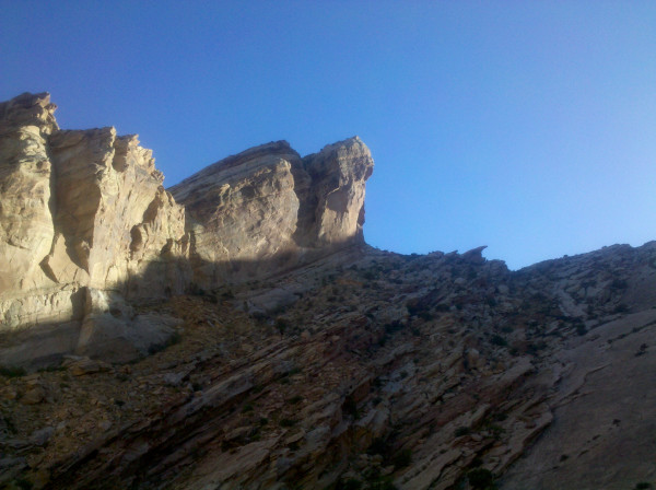 a rocky mountain with blue sky