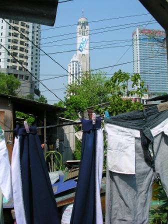 clothes on a clothesline in front of a tall building