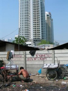 a man sitting in front of a building