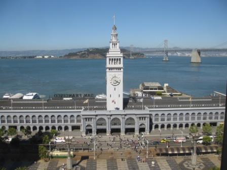 a clock tower in front of San Francisco Ferry Building