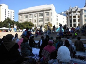 a group of people sitting on steps outside a building