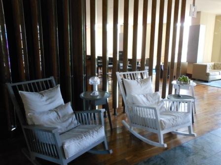 a room with rocking chairs and a table
