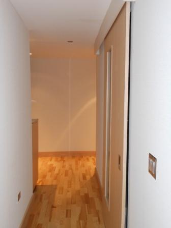 a hallway with a wood floor