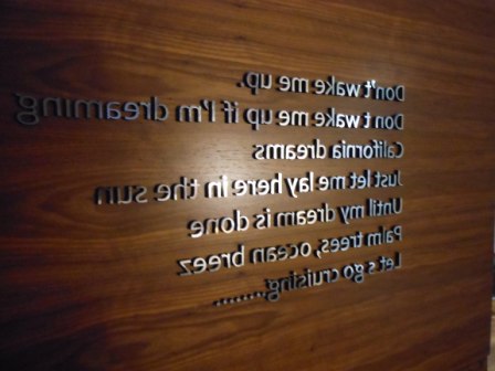 a wood panel with white text