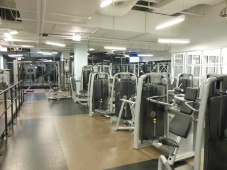 a gym with several exercise equipment