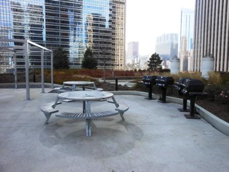 a picnic area with grills and tables