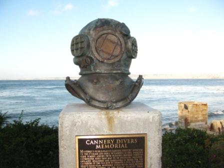 a statue of a diver on a pedestal