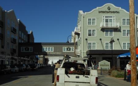 a white truck parked in front of a hotel