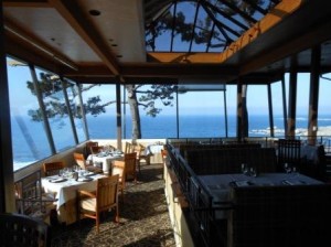 a restaurant with a view of the ocean