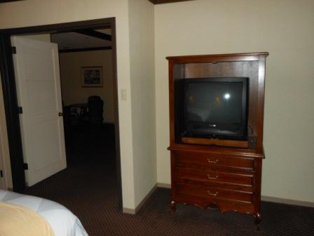 a tv on a dresser in a room