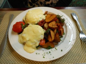 a plate of food with eggs and potatoes