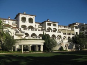 a large white building with many balconies