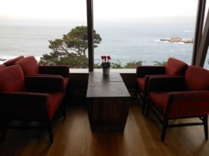 a room with red chairs and a table