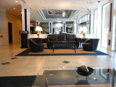 a lobby with a couch and chairs