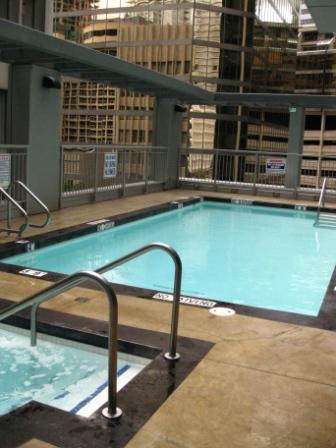 a swimming pool with railings