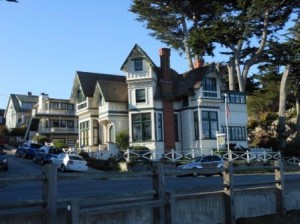 a large white house with a fence