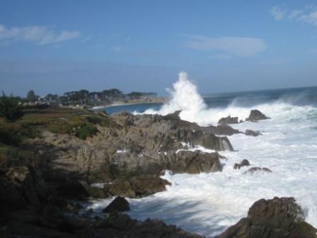 waves crashing against rocks on a rocky beach