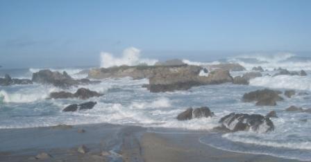waves crashing waves on rocks on a beach