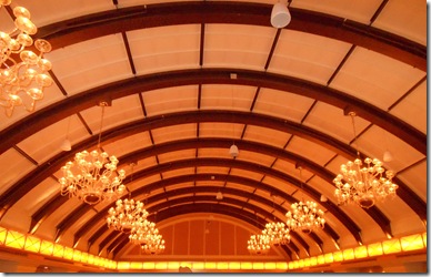 a ceiling with many chandeliers