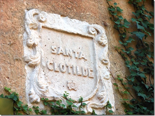 a stone sign on a wall