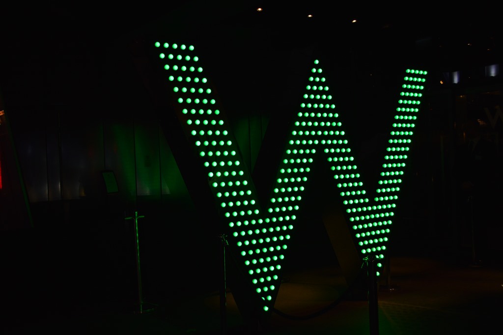a large green light up sign