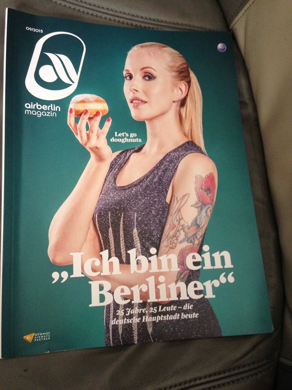 a magazine with a woman holding a donut