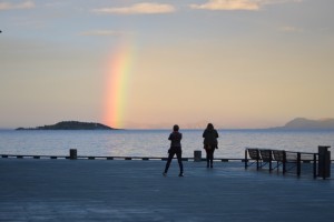 a rainbow over a body of water