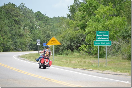 a man riding a motorcycle on the road