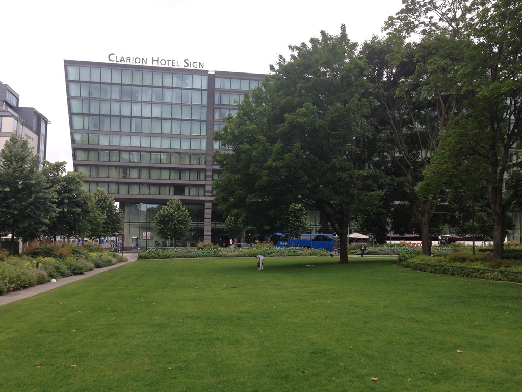 a building with a lawn and trees