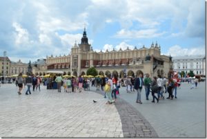 a group of people walking in front of a building