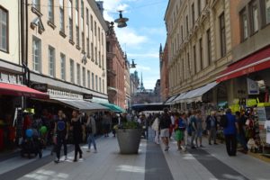 a group of people walking on a street