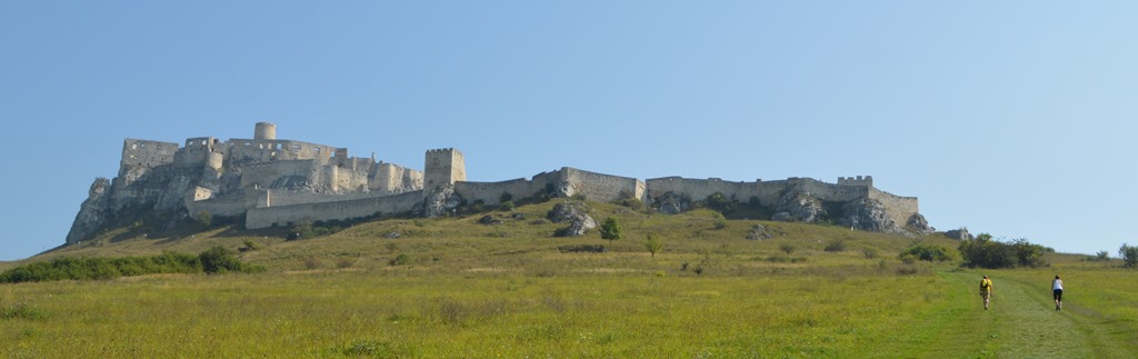 a stone castle on a hill