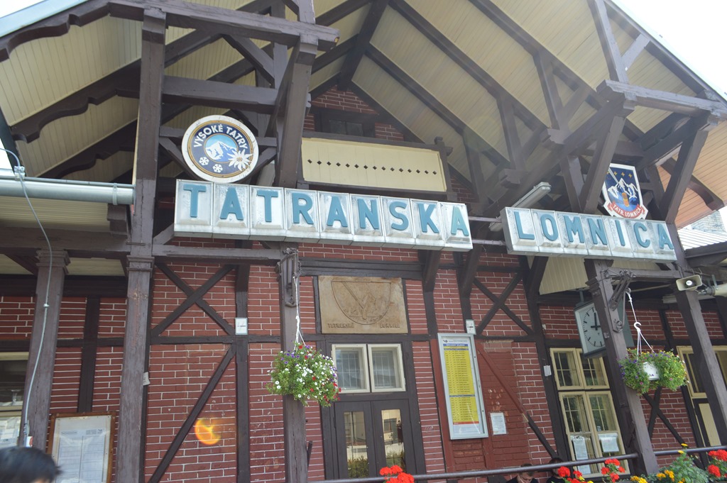 a building with a sign and clock