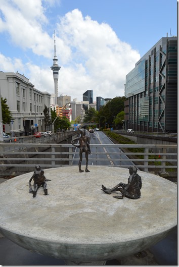 a group of statues on a concrete surface