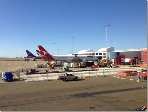 a group of airplanes at an airport