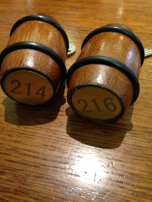a pair of wooden barrels with numbers on them