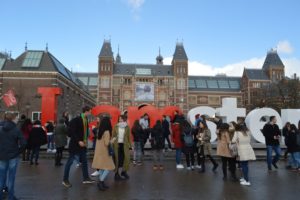 a group of people standing in front of Rijksmuseum
