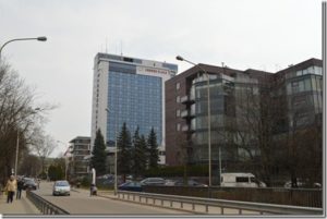 a street with cars and buildings