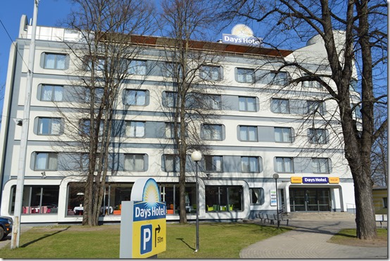 a hotel with trees in front of it