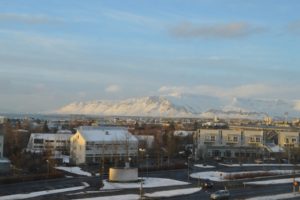 a city with snow covered mountains