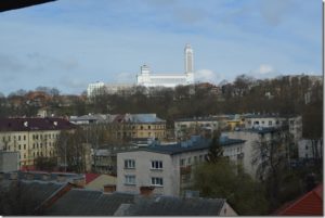 a group of buildings with a tall white tower