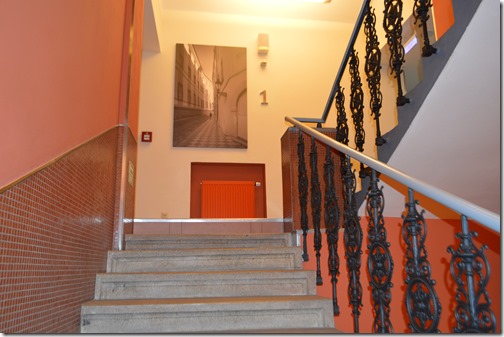 a staircase with a metal railing