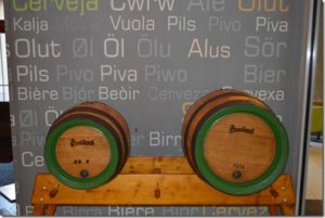 two wooden barrels on a shelf