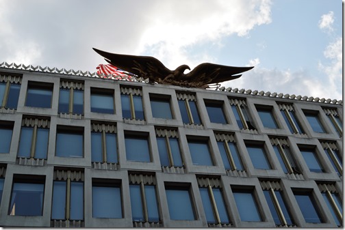 a building with a statue of an eagle on top