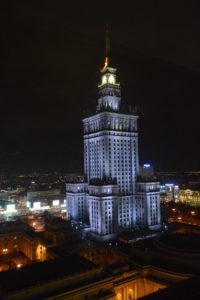 a tall building with a spire at night